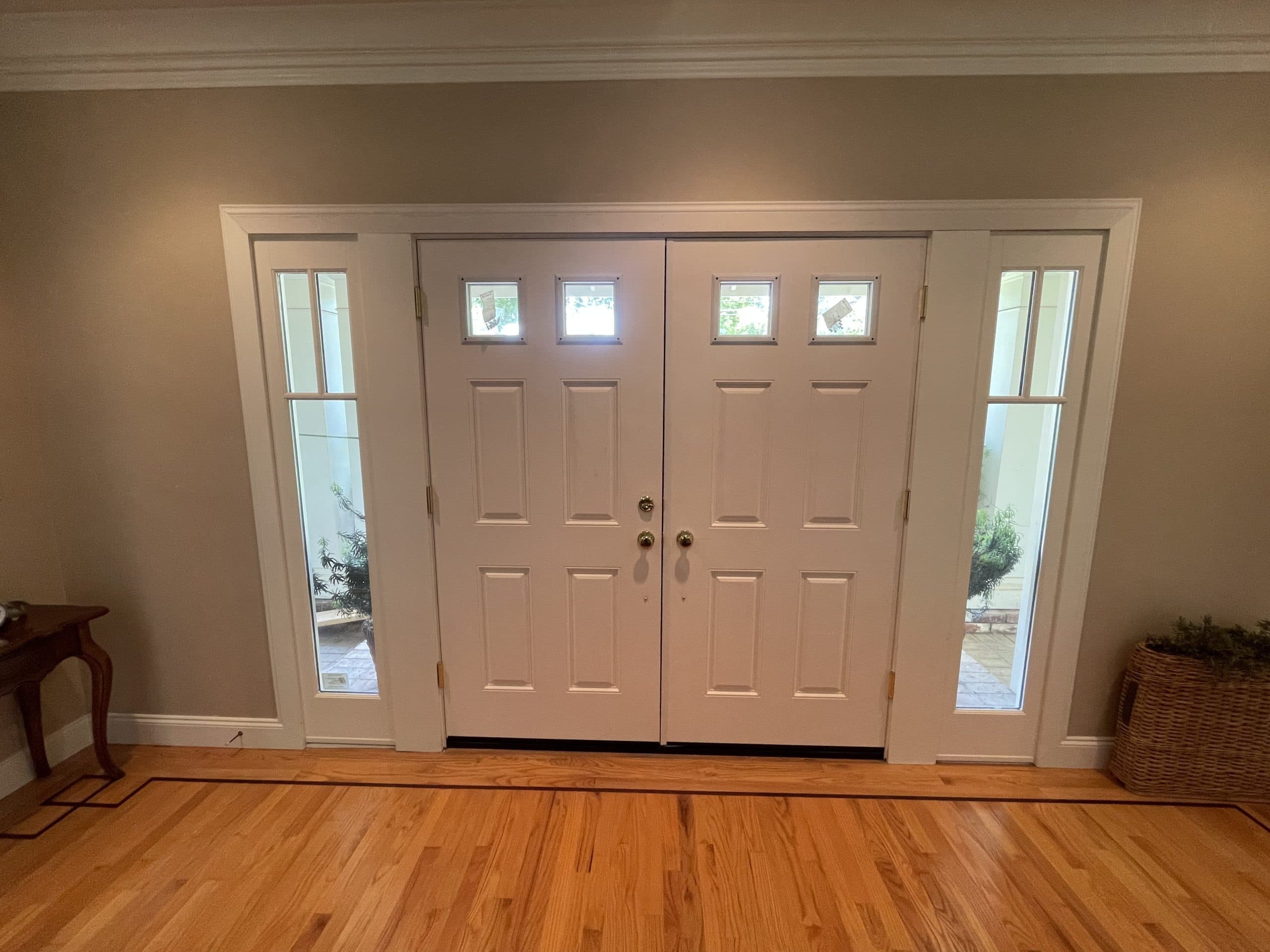 Custom French doors with glass panes and stained finish Carmichael