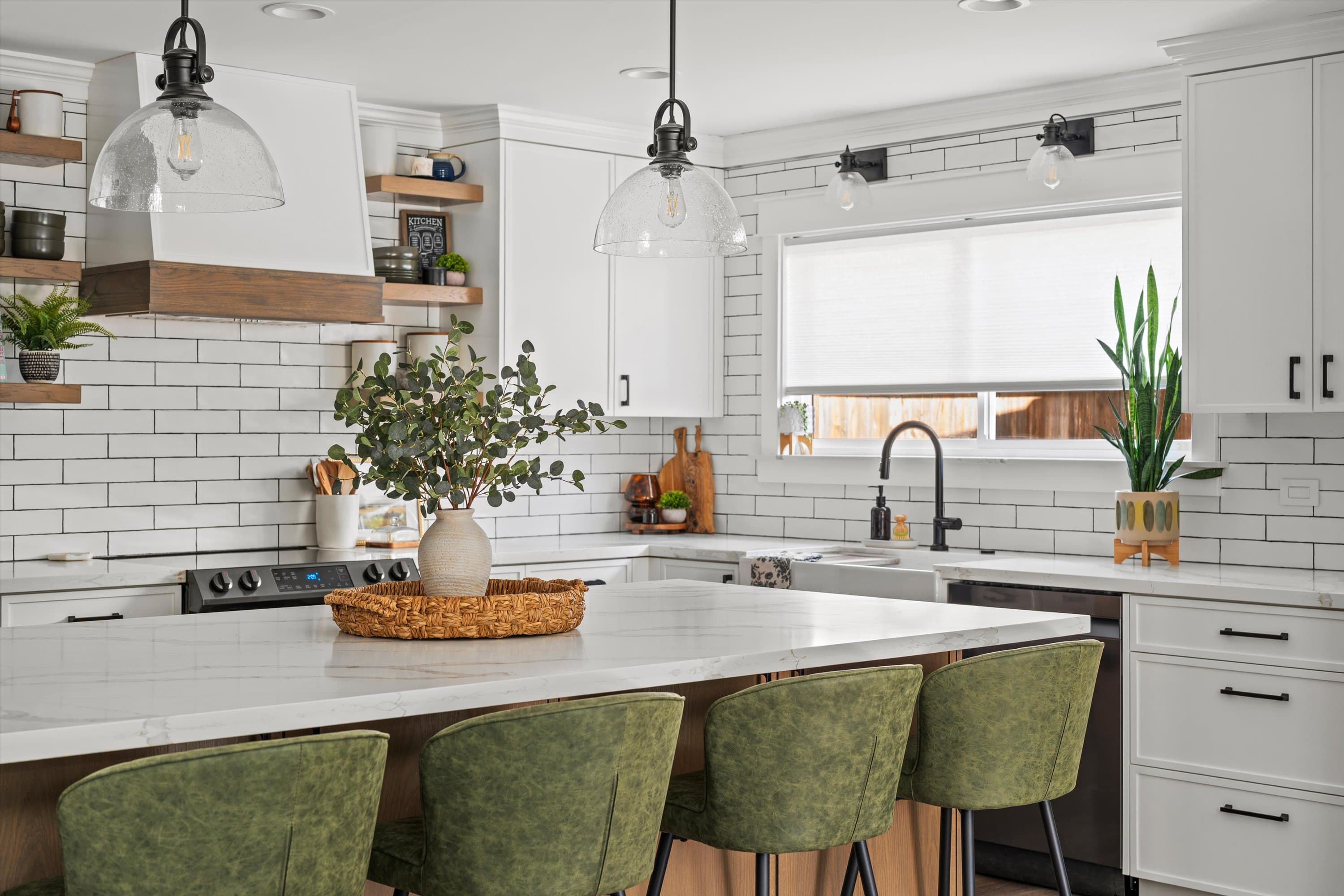 Remodeled kitchen with custom backsplash and island